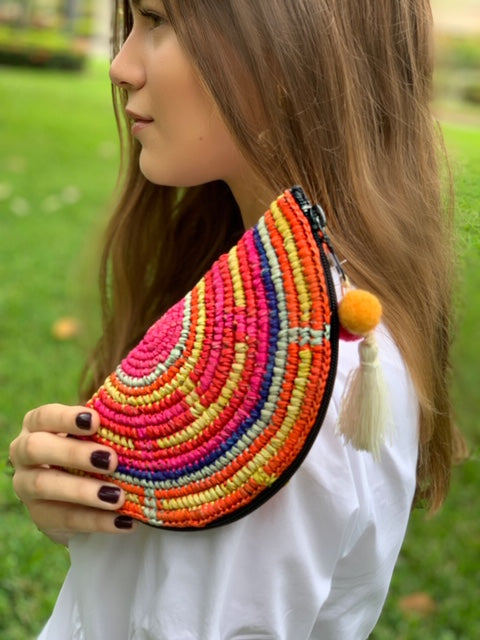 Small half-moon colorful crochet purse crafted with toquilla straw